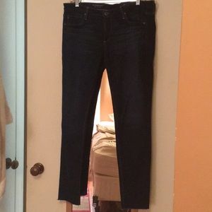 AG skinny dark jeans with distressed hem